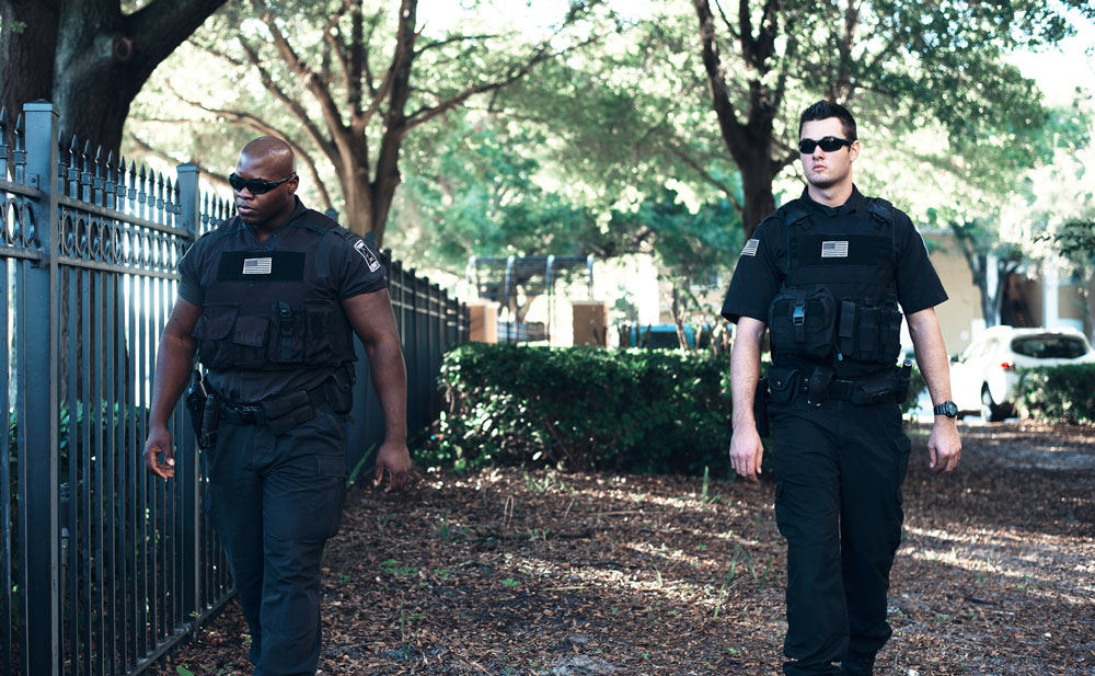 Armed guards patrolling residential area